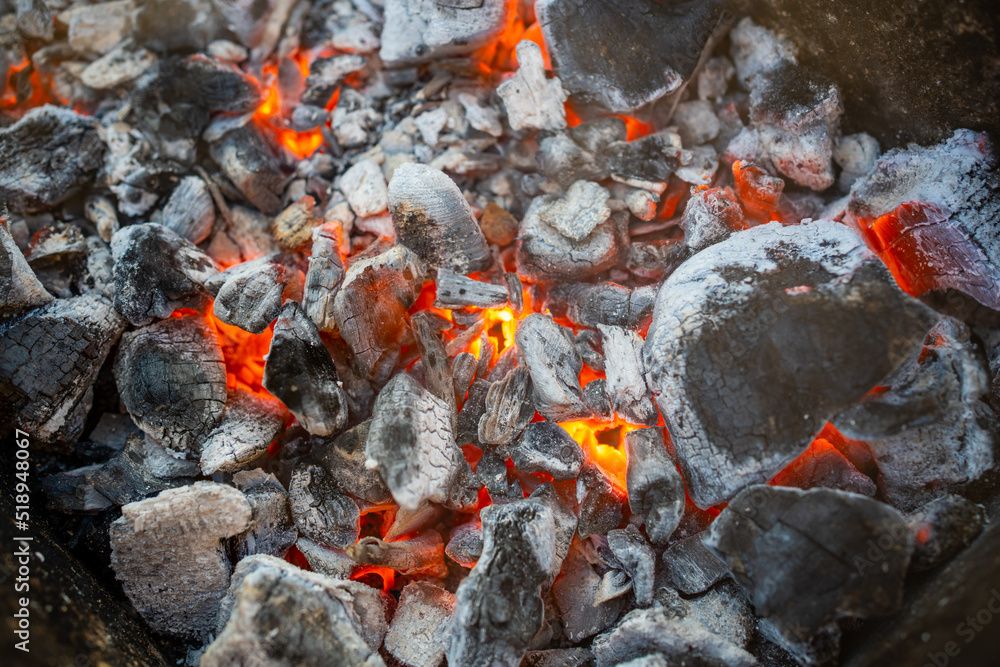 Close-up of a coals, barbecue grill with extinguished charcoal for barbecue or shish kebab Close-up of a coals, barbecue grill with extinguished charcoal for barbecue or shish kebab