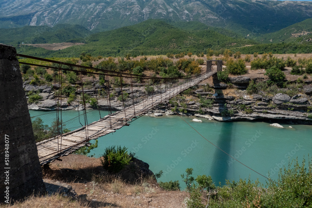 Permet, Albania A crumbling wooden and steel footbridge bridge over the Vjosa river