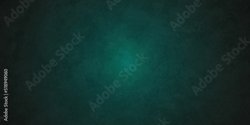 Dark green chalkboard Elegant dark emerald green grunge backdrop background with black shadow border and old vintage grunge texture.