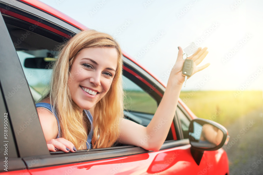 Woman car driver woman smiling showing new car keys and car.