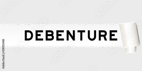 Ripped gray paper background that have word debenture under torn part