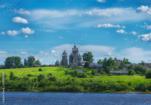 Arkhangelsk region  the village of Turchasovo near the Onega River. the old wooden Church of the Transfiguration of 1786 and the bell tower of 1793. View of ancient architecture across the river