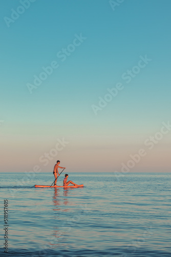 Sea at sunset a doing kayaking  © Karim