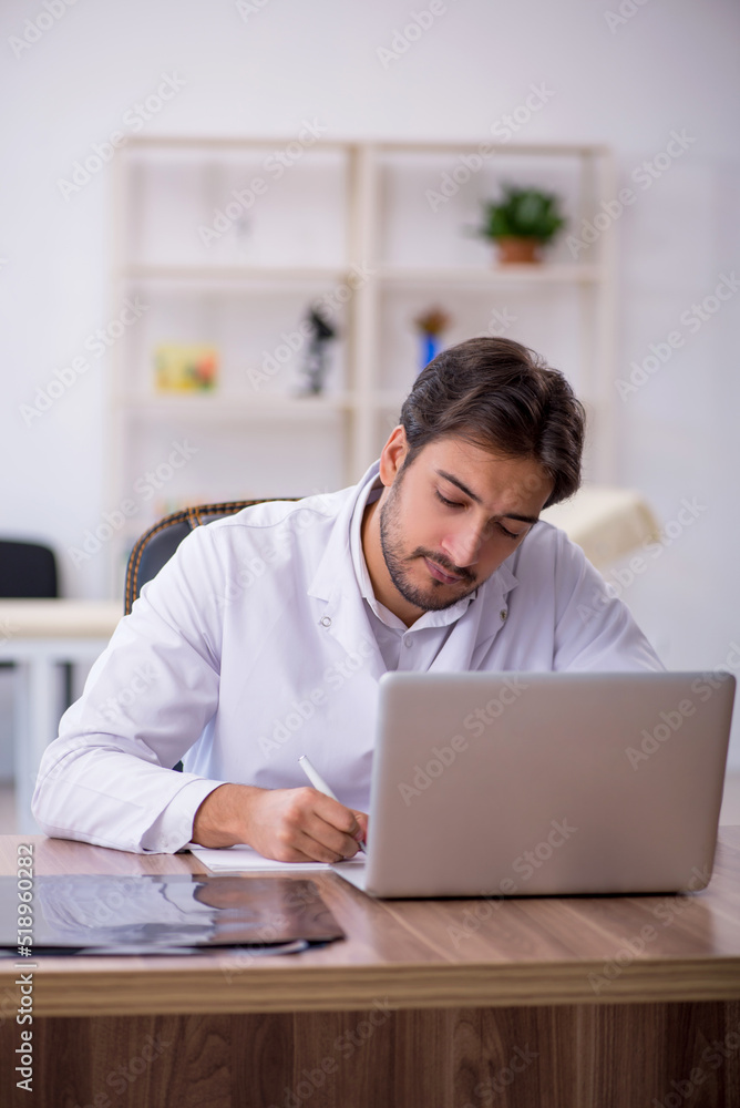 Young male doctor in telemedicine concept Young male doctor in telemedicine concept