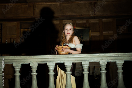 Actress woman in stage light on the balcony photo