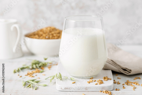 Oat milk. Healthy vegan non dairy alternative oat milk drink in a glass photo