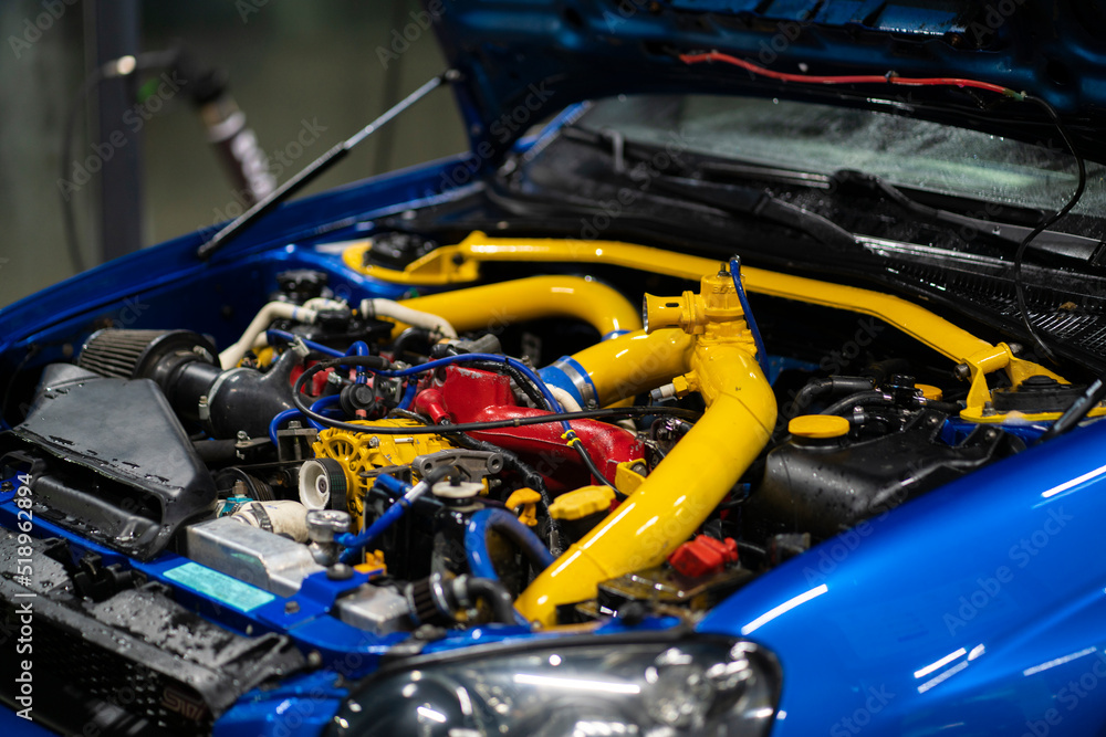 beautiful turbo sport car engine bay with yellow pipes beautiful turbo sport car engine bay with yellow pipes