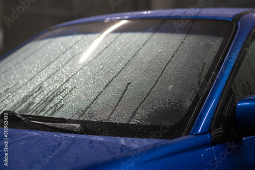 Фотография car shiny hydrophobic coating, close up waterdrops on the automobile
