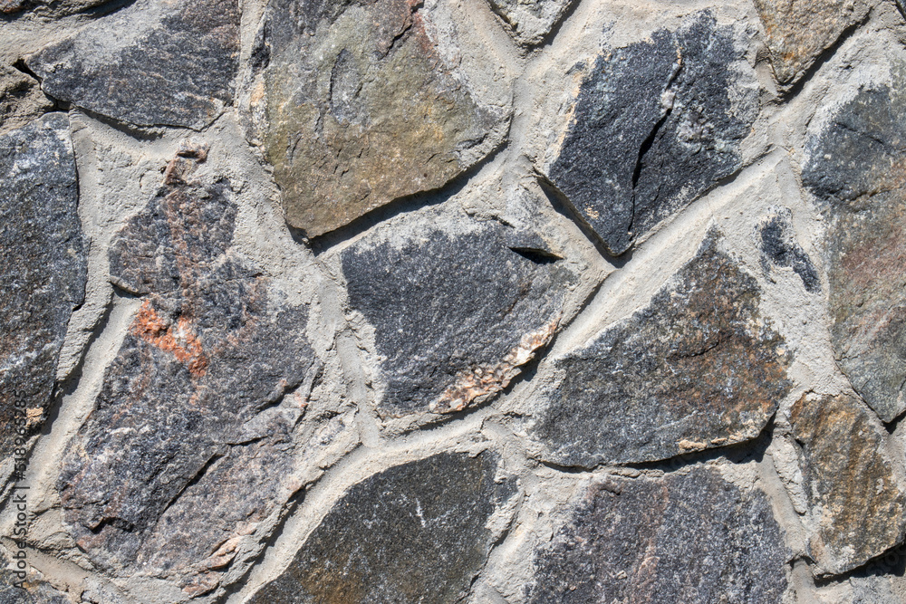 Fototapeta premium Stone wall background. Natural stone texture. Close-up