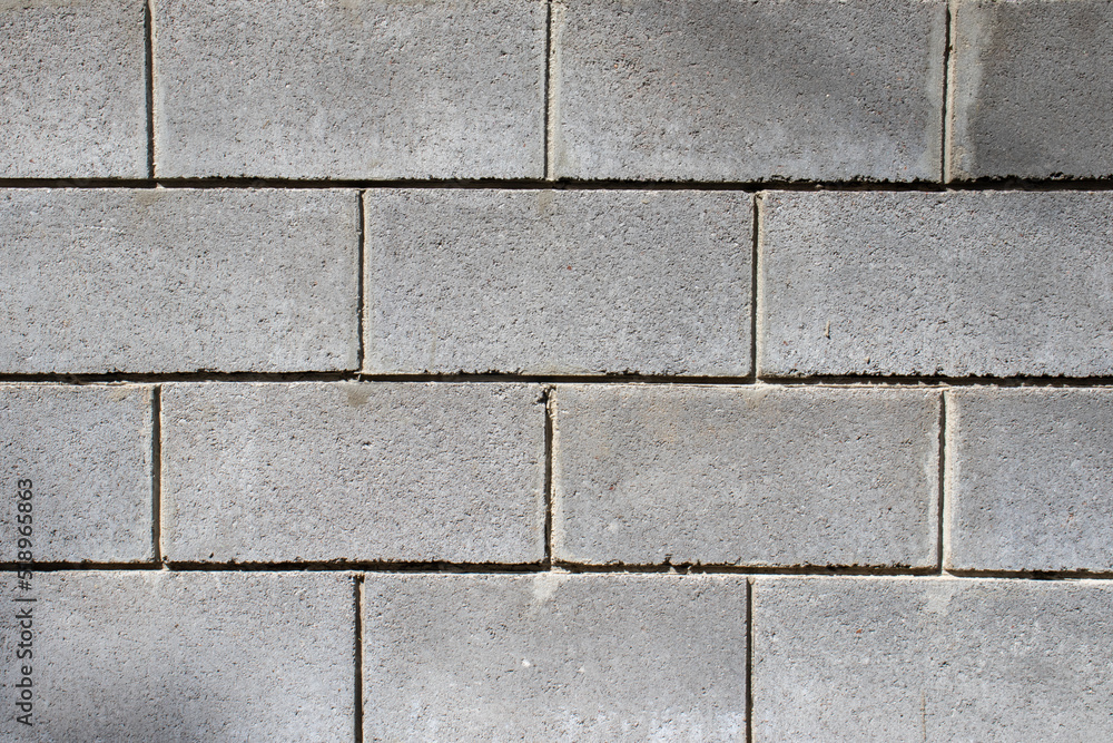 Gray brick wall background. Stone wall texture. Close up Gray brick wall background. Stone wall texture. Close up