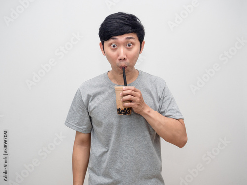 Asian man drinking boba tea isolated