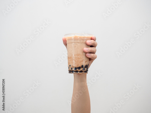 Hand holding boba tea isolated