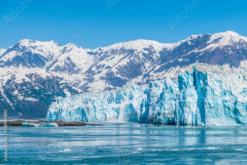 A view in Disenchartment Bay past islets towards in the snout of the Hubbard Glacier, Alaska in summertime