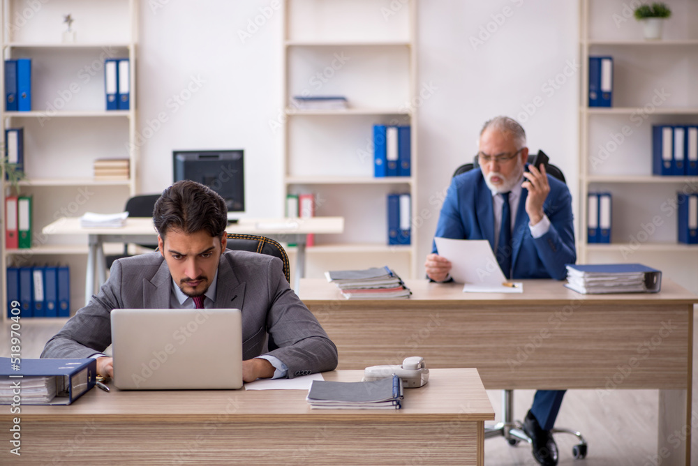 Two male colleagues working in the office Two male colleagues working in the office