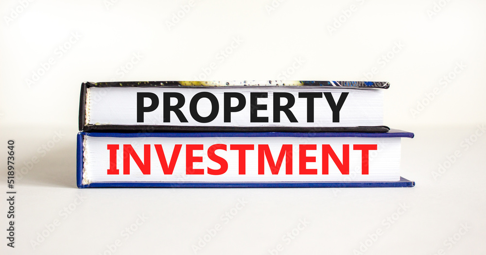 Property investment symbol. Concept words Property investment on books on a beautiful white table white background. Business Property investment concept. Copy space.
