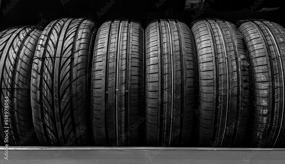 Car wheels. Close up new tires. Auto repair service background. Automobile shop. Car wheels. Close up new tires. Auto repair service background. Automobile shop.