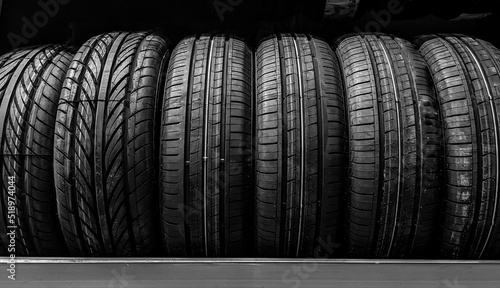 Car wheels. Close up new tires. Auto repair service background. Automobile shop.