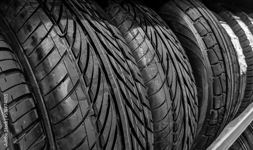 Car wheels in the garage. Close up new tires.   Automotive background. Rubber tires.Automobile shop