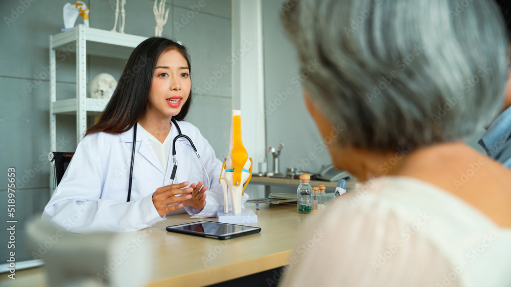 Female patient and her son came to see the doctor by appointment and receive additional medications as prescribed by the doctor. Specialist female doctor Talking to the patient in a good mood. Female patient and her son came to see the doctor by appointment and receive additional medications as prescribed by the doctor. Specialist female doctor Talking to the patient in a good mood.