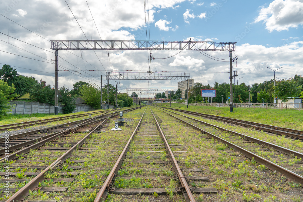 Railway and sleepers close-up. A major railway interchange near the station for train traffic, logistics between cities, cargo transportation. Railway and sleepers close-up. A major railway interchange near the station for train traffic, logistics between cities, cargo transportation.