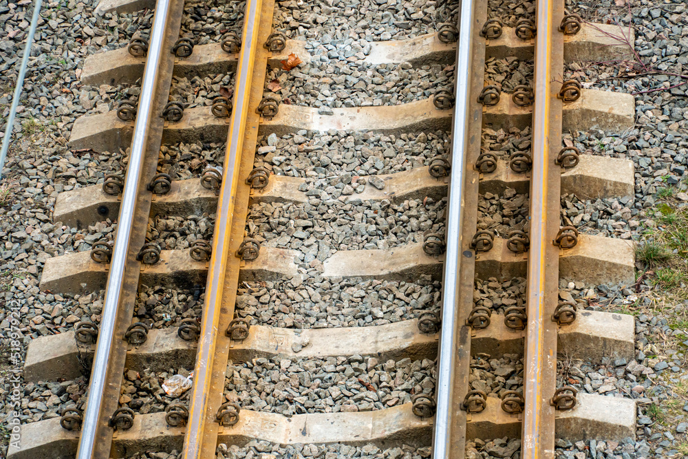 Railway and sleepers close-up. A major railway interchange near the station for train traffic, logistics between cities, cargo transportation. Railway and sleepers close-up. A major railway interchange near the station for train traffic, logistics between cities, cargo transportation.