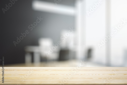 Empty office wooden table with empty space on modern workplace with computer background, close up, mockup