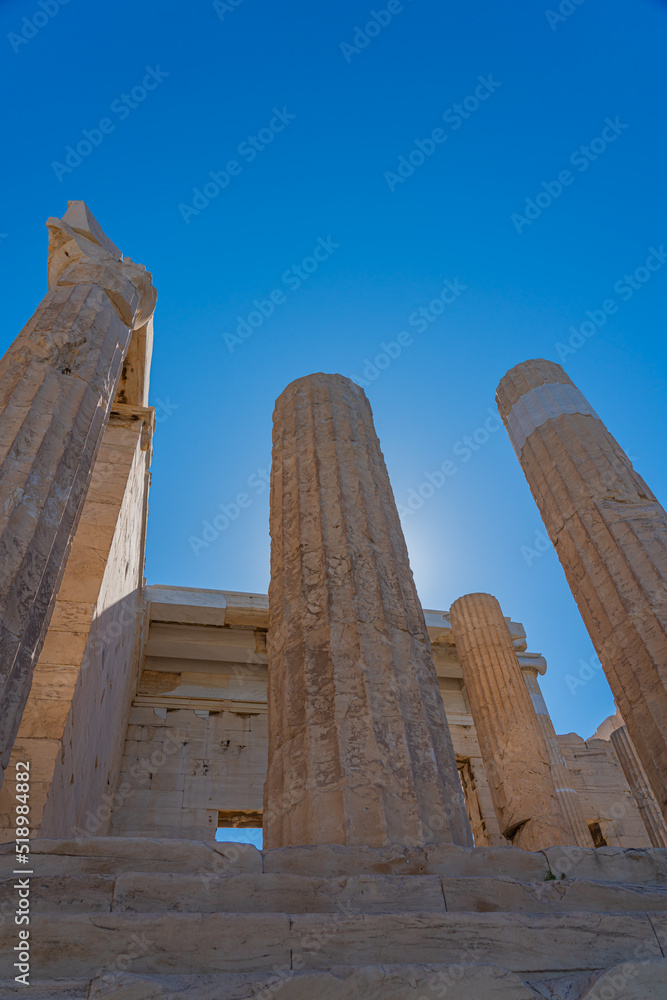 Columns of Athena Nike temple on Acropolis, landmark of Athens. Scenic view of classical building on famous Acropolis hill, vertical