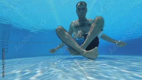 Man diving and swimming underwater in pool. swim in pool, underwater shot. Travel, tourism, vacation, holiday concept.