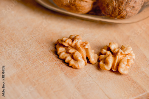 Healthy bio walnuts on wood desk with detail background, walnut on wood kitchen underlay.