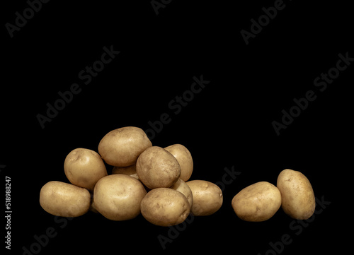 vegetables harvest potatoes on black background
