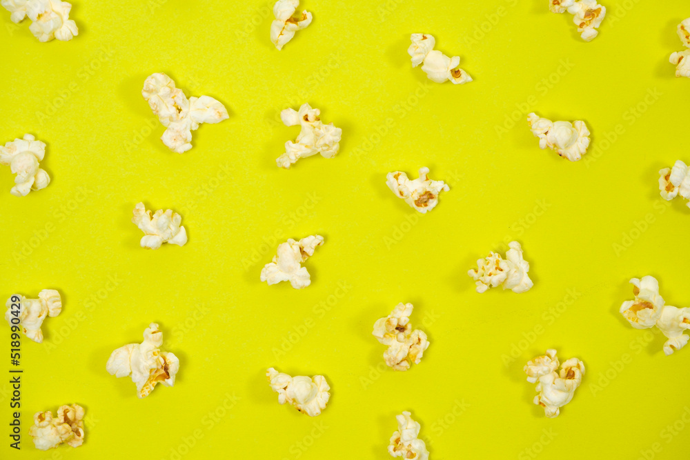 Popcorn on a yellow background, close-up view from above Popcorn on a yellow background, close-up view from above