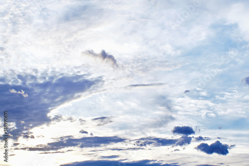 Sunset clouds with sun setting down. Beautiful evening sky with clouds background