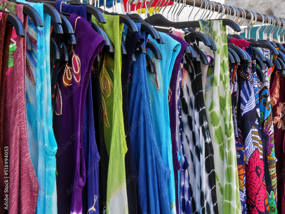 Colourful clothes on sale at an outdoor market
