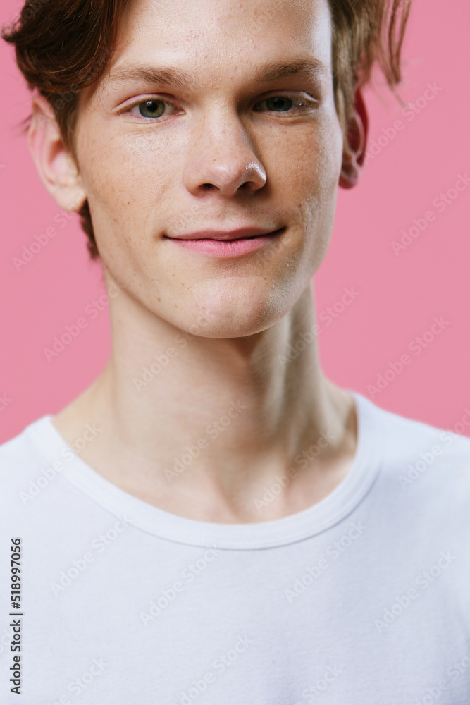 portrait of a handsome, red-haired, attractive guy with freckles on his face, looking at the camera with a slight smile on his face. portrait of a handsome, red-haired, attractive guy with freckles on his face, looking at the camera with a slight smile on his face.