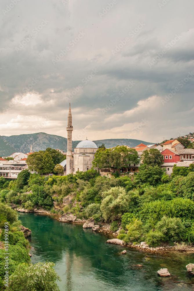 View  on Nerteva River and Old City of Mostar with Ottoman Mosque; Mostar in Bosnia and Herzegovina. 