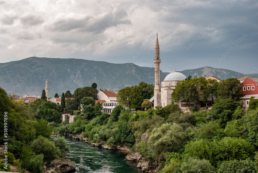 Obraz premium View on Nerteva River and Old City of Mostar with Ottoman Mosque; Mostar in Bosnia and Herzegovina. 