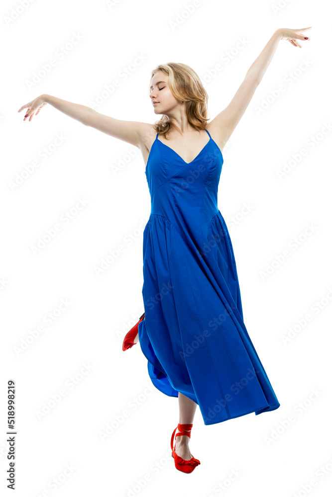 A young girl in a long blue dress is dancing. Activity, grace and movement. Isolated on white background. Vertical. A young girl in a long blue dress is dancing. Activity, grace and movement. Isolated on white background. Vertical.