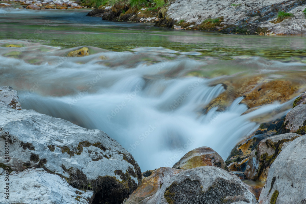 Light blue water in Soca river in summer hot evening in Slovenia Light blue water in Soca river in summer hot evening in Slovenia