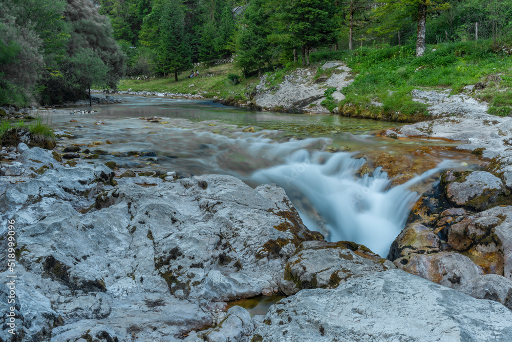 Fototapeta premium Light blue water in Soca river in summer hot evening in Slovenia