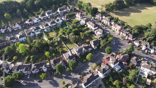 Aerial drone footage of Woodford Green in East London on the boarder of Essex, England UK, showing upmarket residential housings, and semi detached houses in the morning summer time sun photo