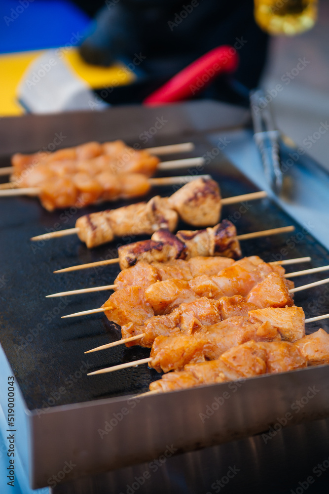 Meat on the grill. Chicken is fried on a stick, skewers, kebab