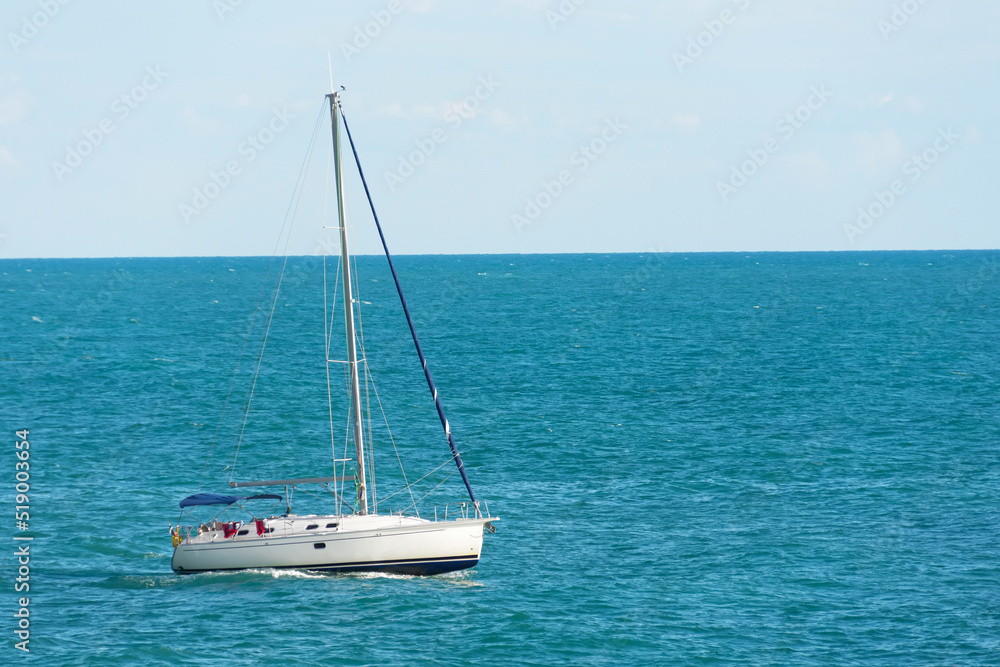 Yacht boat floats on the sea against the background of the horizon. Yacht boat floats on the sea against the background of the horizon.
