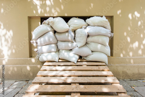 sandbags near air raid bomb shelter windows. War in Ukraine photo