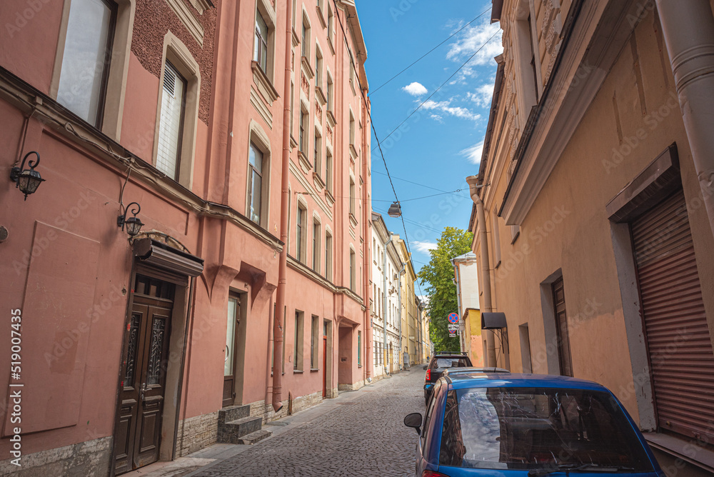 Narrow alley (backstreet) in an old European city. Historic district of St. Petersburg, Russia - Repina Street.