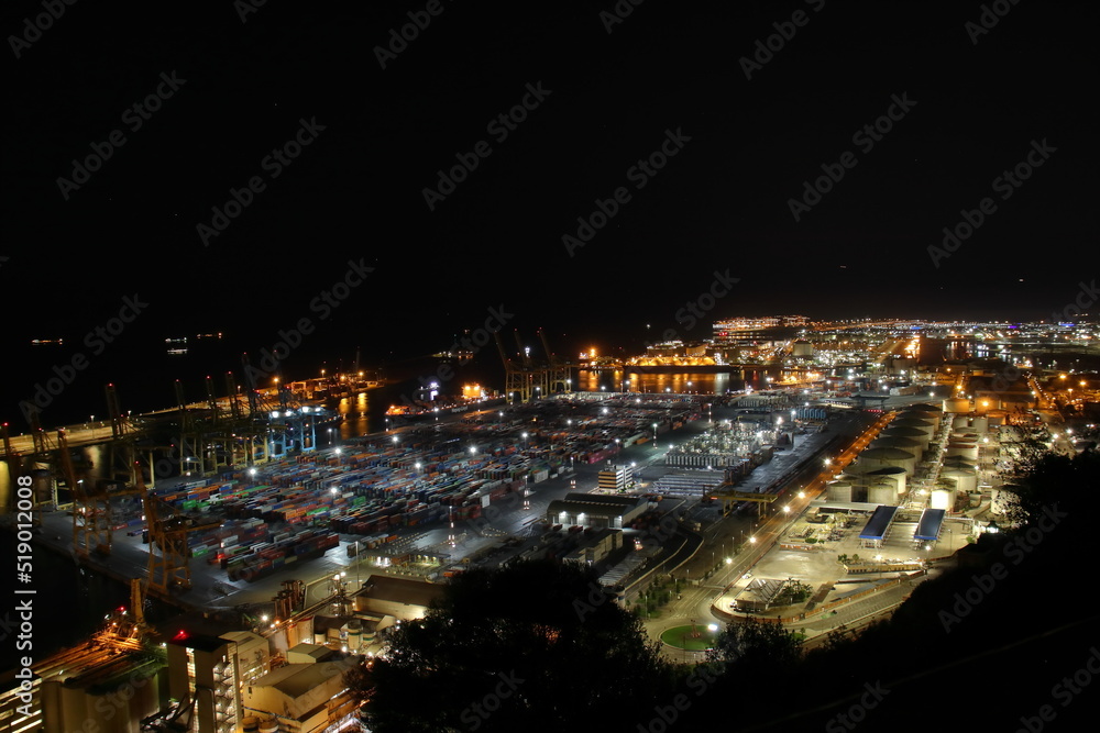 Night Panoramic view of barcelona and cargo port in spain