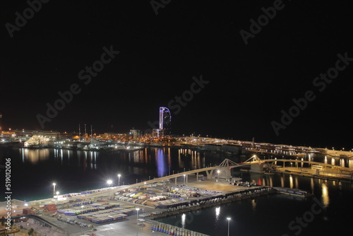 Night Panoramic view of barcelona and cargo port in spain 