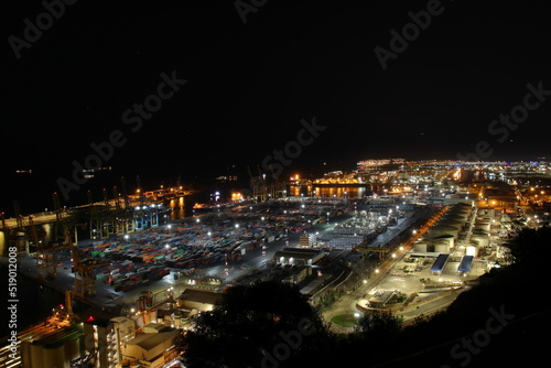 Night Panoramic view of barcelona and cargo port in spain