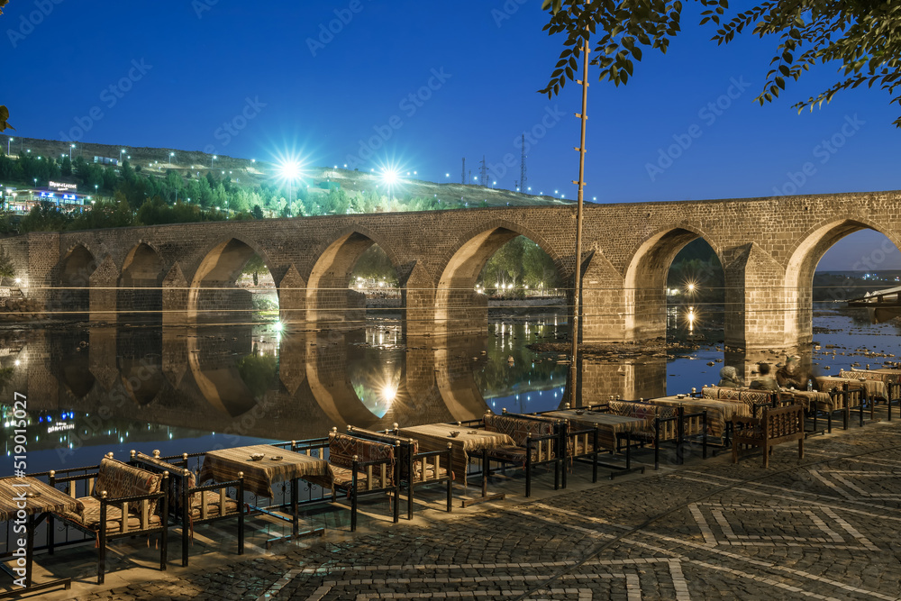 Diyarbakir, Turkey historic ten-eyed bridge view over the Tigris river at night, Turkey
