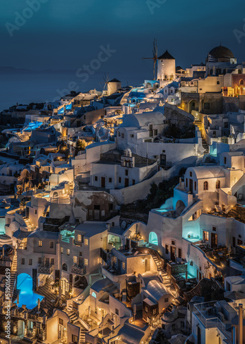 Scenic blue hour at Oia, the most typical village of Santorini and popular honeymoon destination, Greece