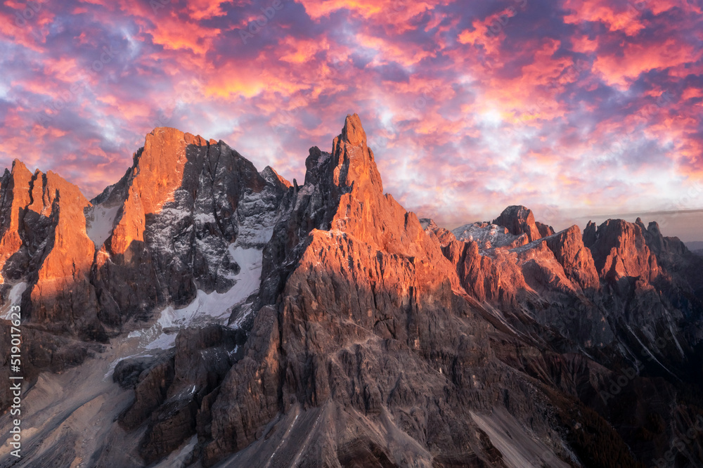 Pale di San Martino mountain group in sunset time. Hight mountains with glacier glowing by sunset light. San Martino di Castrozza, Dolomites, Trentino, Italy